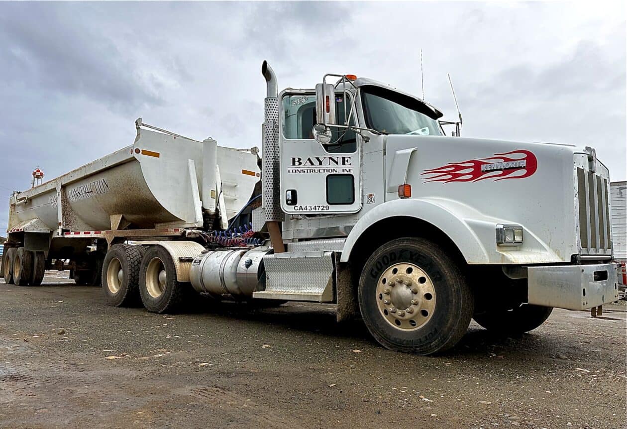 Bayne Construction semi truck with end dump trailer